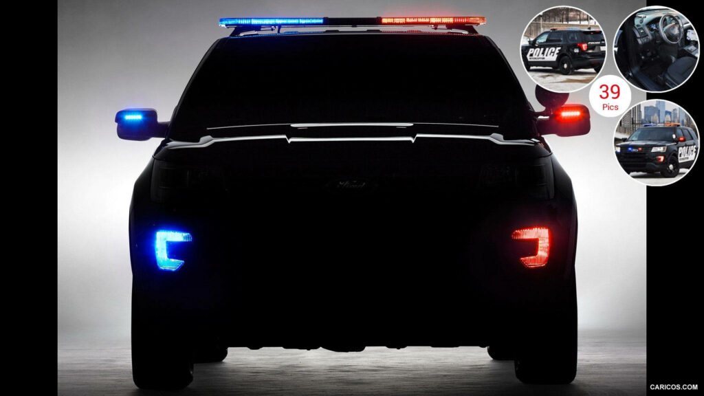 The Ultimate Guardian: Ford Police Interceptor Utility Illuminated in Pursuit Wallpaper