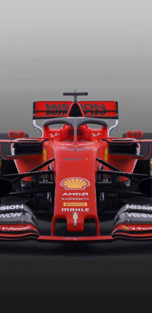 Unleashing the Beast: Ferrari F1's Dynamic Racecar on the Turbulent Track Wallpaper
