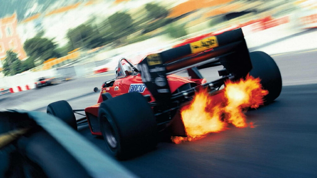 Ferrari's Roaring Rivalry: A Spectacular Wallpaper of a High-Speed Race