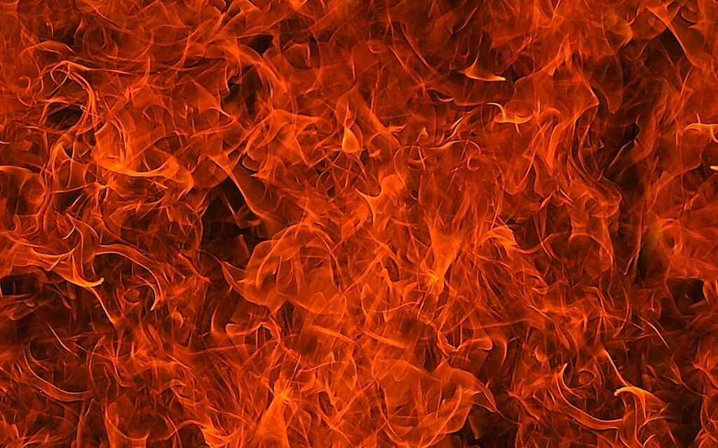 Vibrant HD fire wallpaper with intense orange and red flames creating a fiery background