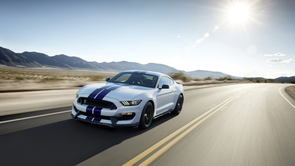 Sun-Kissed Shelby: A White Ford Shelby GT350 Mustang Shines in the Sunshine Wallpaper