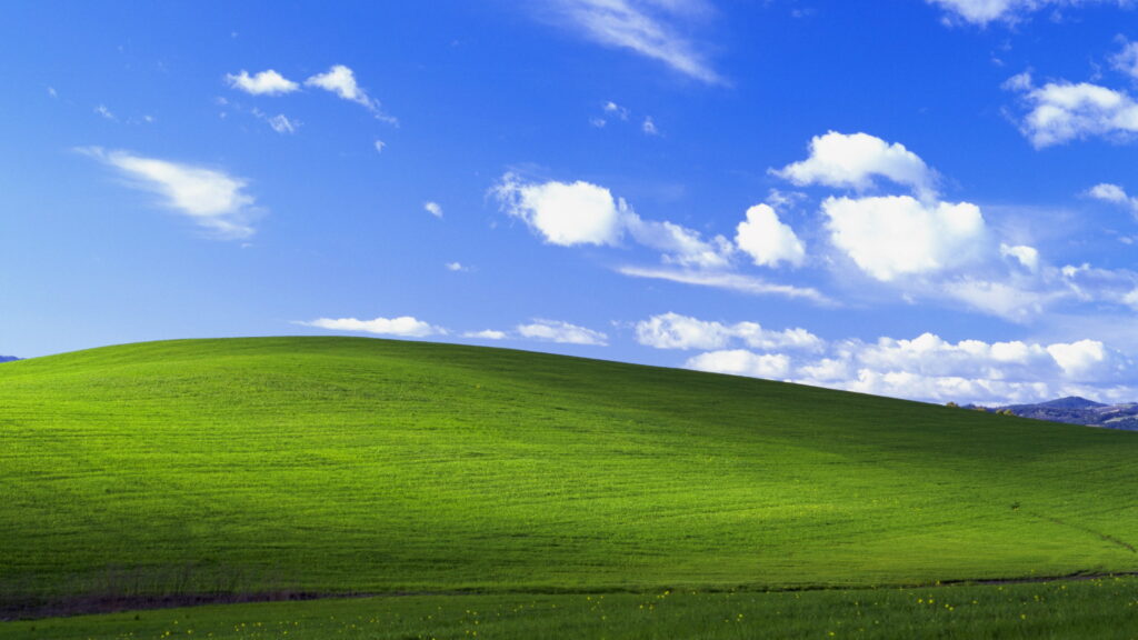 Windows XP Bliss Reimagined: Breathtaking 4K Landscape Wallpaper for Your Stock Collection