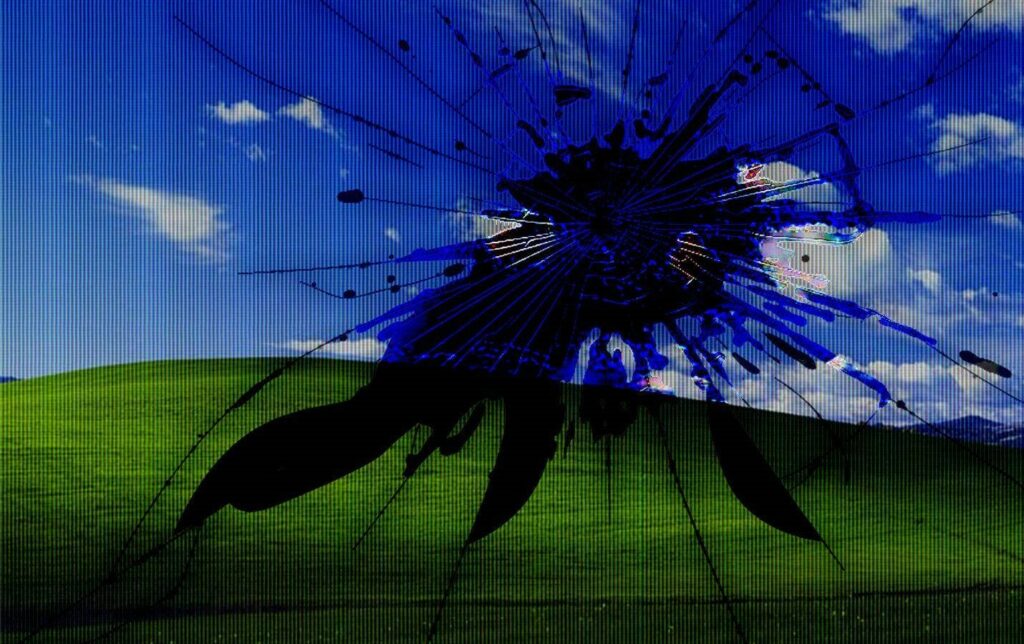Blissful Imperfections: A Cracked Screen Remix of the Iconic Wallpaper