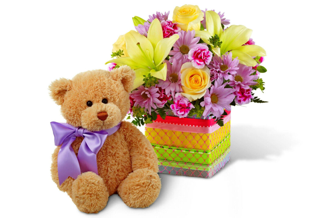 Teddy Bear's Floral Surprise: A Cheerful Birthday Celebration with Vibrant Blooms Wallpaper