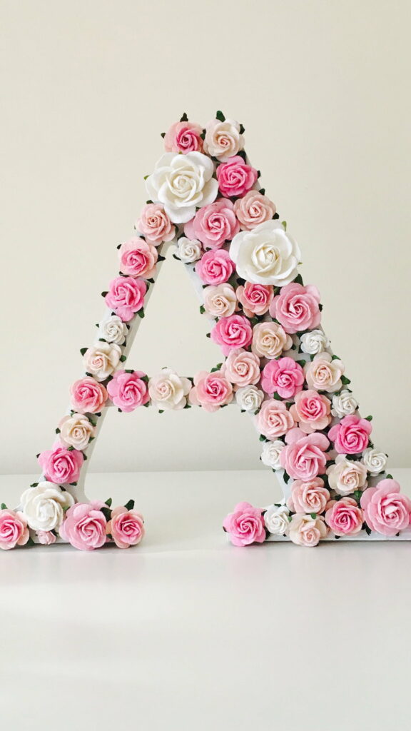 Blooming Typography: Nature's Alphabetic Expression in Stunning HD Phone Background Wallpaper