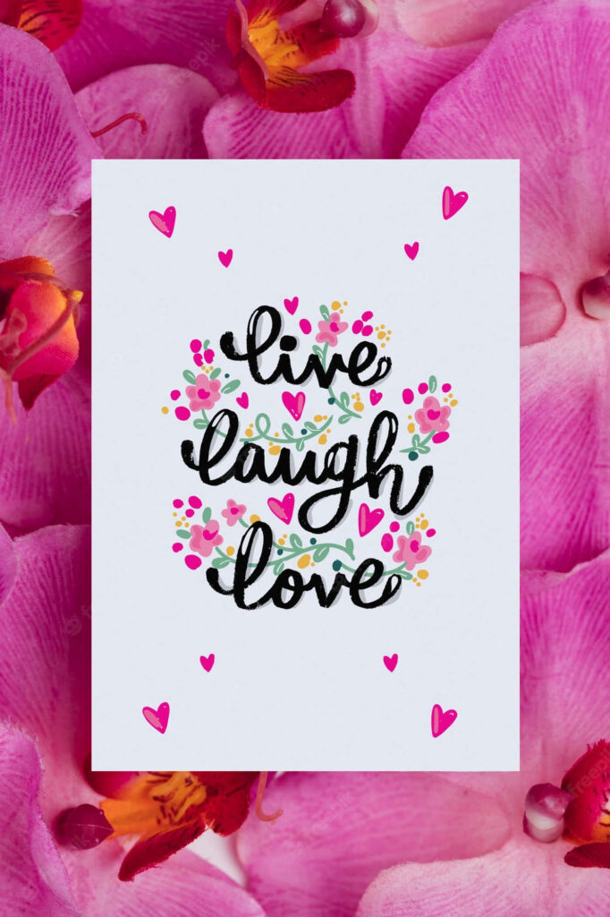 Blossoming Joy: Imprint of Live Laugh Love amidst Pink Petal Canvas Wallpaper