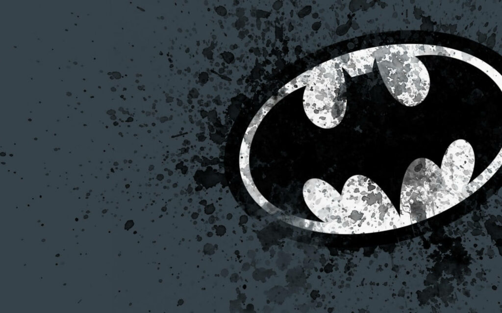 Ink Blotched Batman: A Pop Culture Twist on the Classic Logo Perfect for Screens Wallpaper