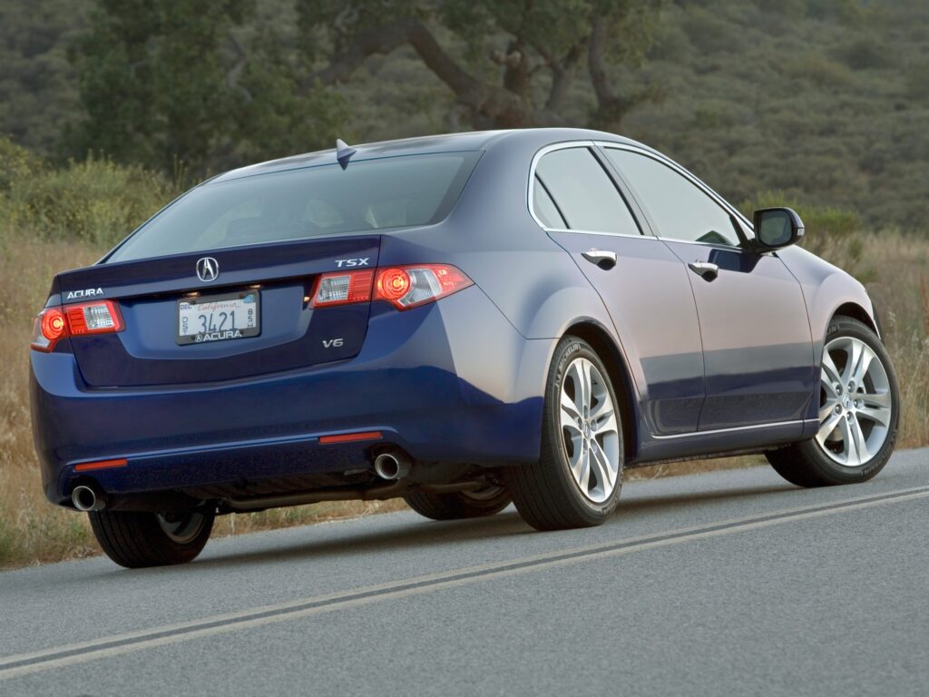 Elegant 2009 Acura TSX V6 Rear View in Scenic Nature Background Wallpaper