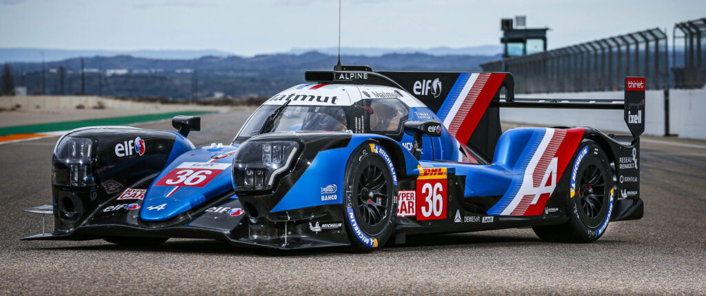 Blue Alpine Car 36 race car on track with aerodynamic design and bold racing livery wallpaper