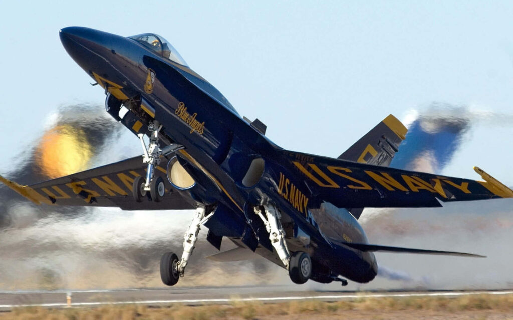 Blue Angels jet taking off from runway showcasing US Navy elite marine fighter precision power Wallpaper