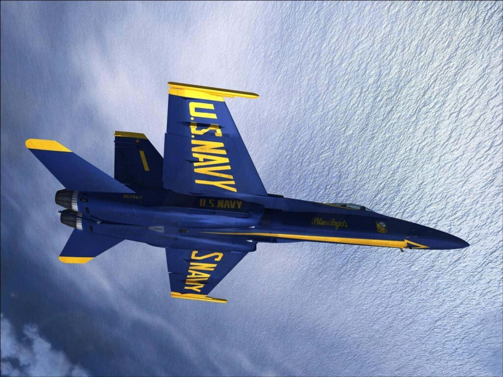 Blue Angels jet flying in precise formation over shimmering ocean with navy blue and gold colors Wallpaper