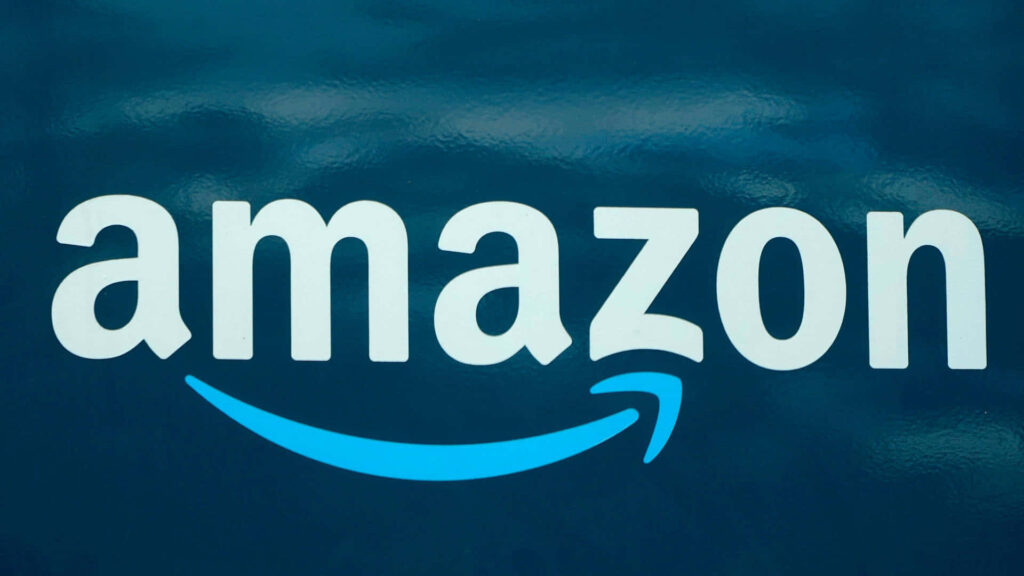 Blue Arrow Soaring Above Amazon UK: A Stunning Wallpaper Featuring the Iconic Logo and Abstract Backdrop