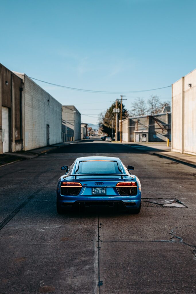 Vibrant Blue Audi R8 Rear View on Urban Street Wallpaper
