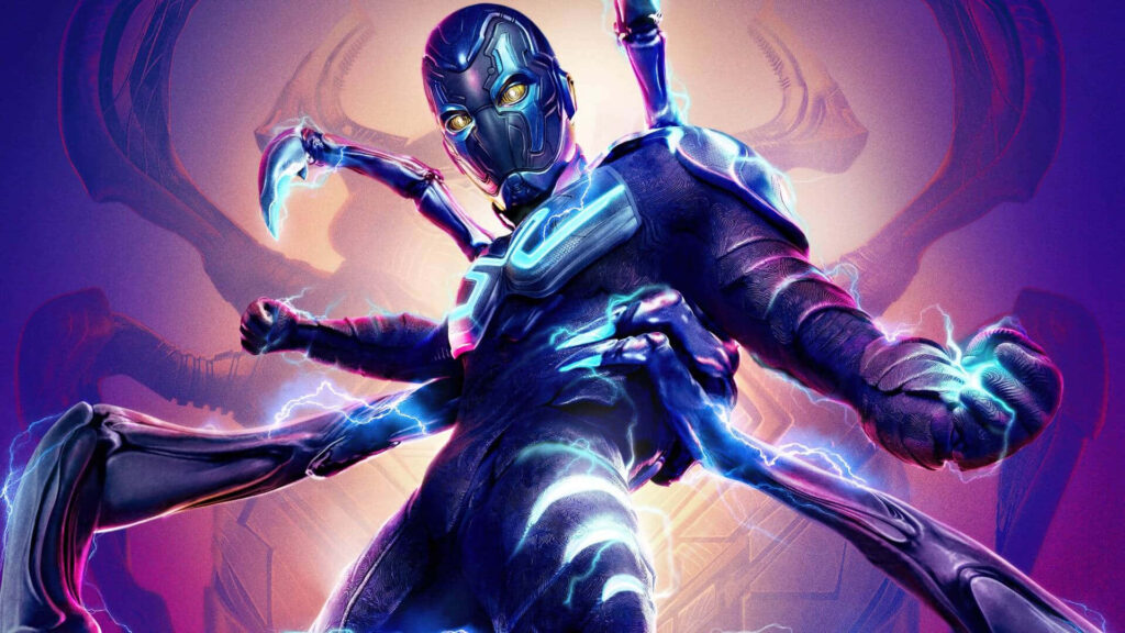 Blue Beetle hero pose with glowing blue energy and mech arms neon-lit wallpaper background