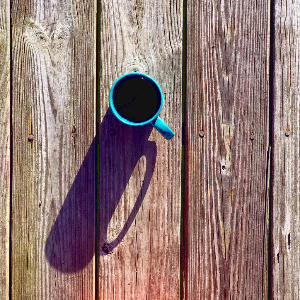 Rustic Blue Coffee Mug on Wooden Boards: Serene Wallpaper Background