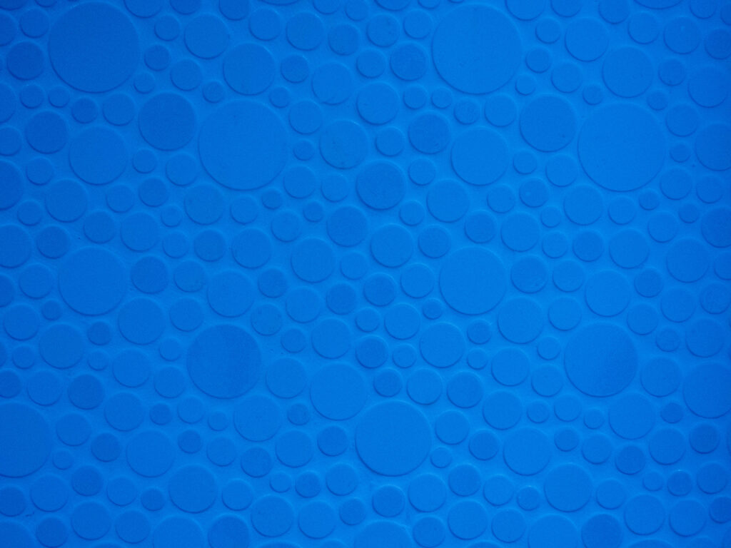 The Vibrant Array: A Blue Symphony of Circles Emanating from the Azure Abyss Wallpaper