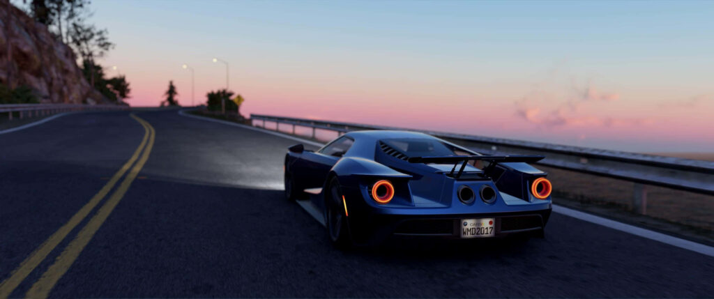 Blue Ford GT driving on scenic road at sunset showcasing sleek design and iconic taillights Wallpaper