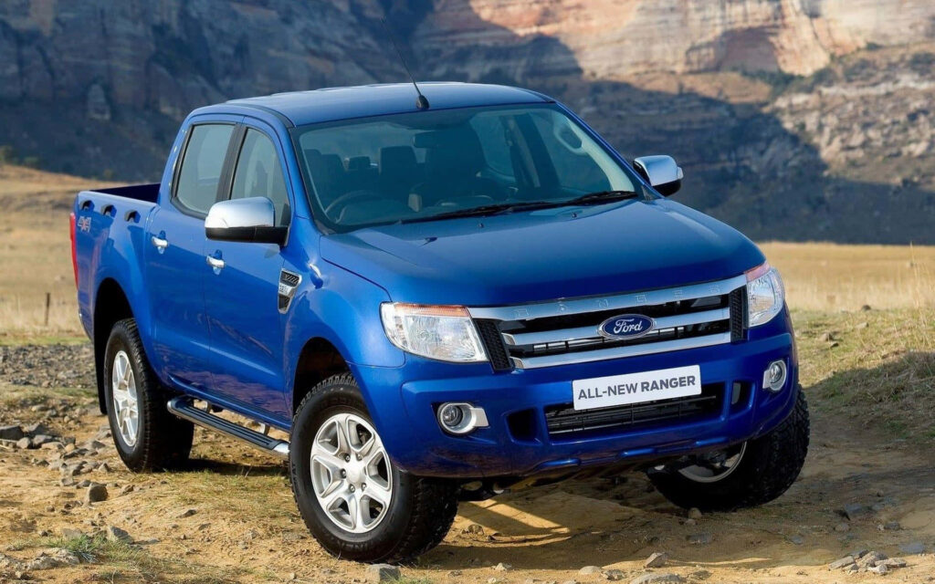 Blue Ford Ranger parked in rugged terrain showcasing durability and stylish off-road design wallpaper