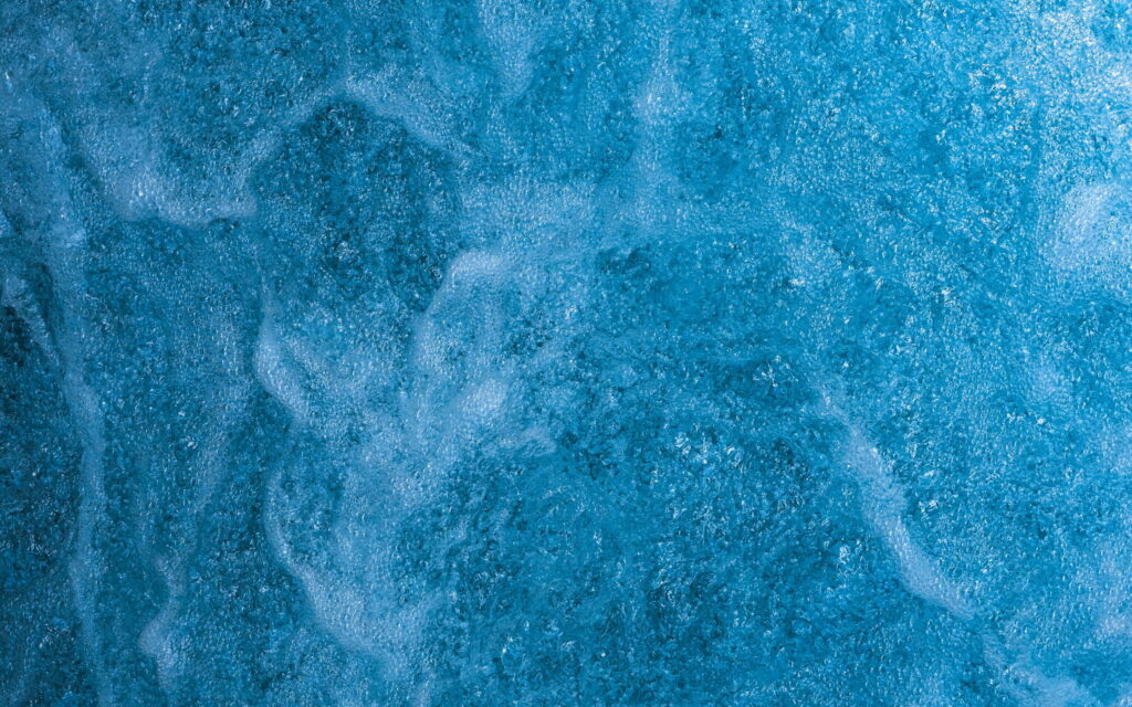 Frozen Elegance: A Mesmerizing Winter Wonderland of Blue Ice Texture Wallpaper