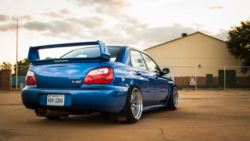 Revved Up Beauty: 4K JDM Tribute - Stunning Back View of Blue Subaru Impreza, Perfect for Wallpaper