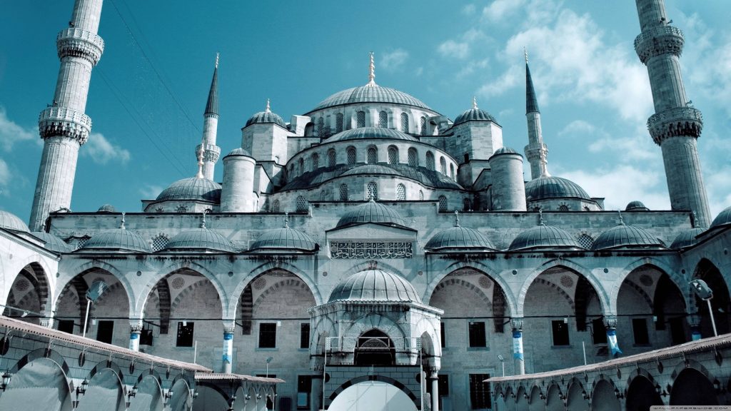 Blue Mosque Istanbul cascading domes and minarets under clear sky majestic architecture wallpaper