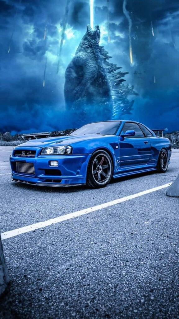Blue Nissan Skyline R34 parked with Godzilla towering over stormy cityscape cinematic wallpaper