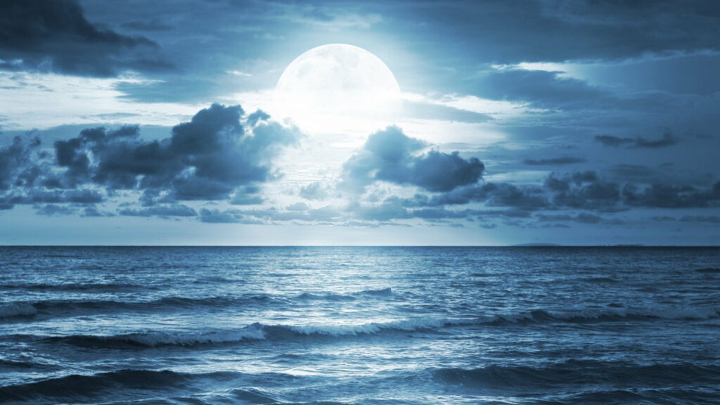 Marvelous Night Serenity: A Captivating HD Seascape with Full Moon Illuminating the Blue Ocean Waters Wallpaper