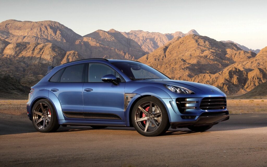 Blue Porsche Macan: Luxury Meets Rugged Mountain Adventure Wallpaper