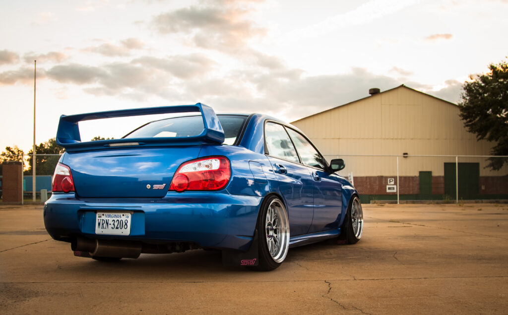 Blue Subaru Impreza WRX STI: Rear View in Urban Setting Wallpaper