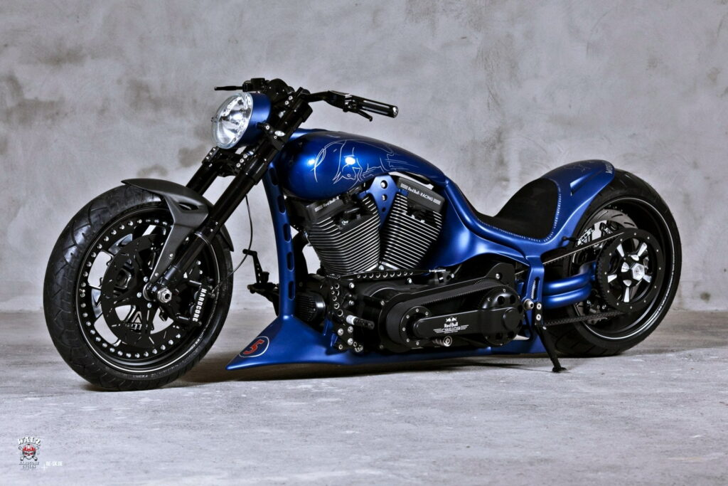 Unleashing the Beast: A Captivating HD Wallpaper of a Bold, Blue and Black Harley-Davidson Motorcycle