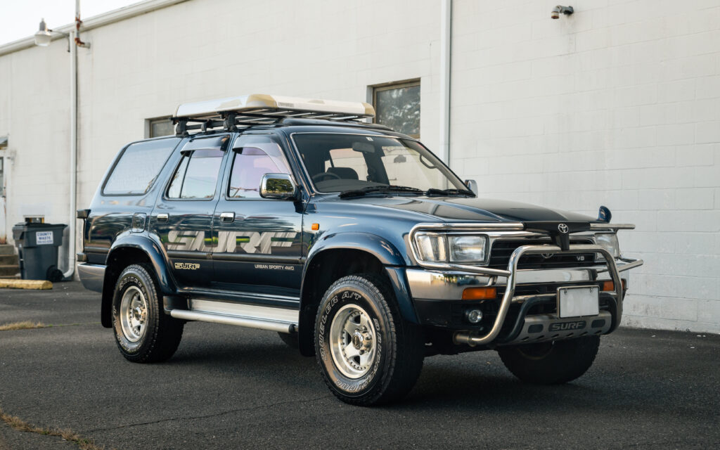 Blue Toyota SUV in Urban Setting - Rugged & Versatile Wallpaper