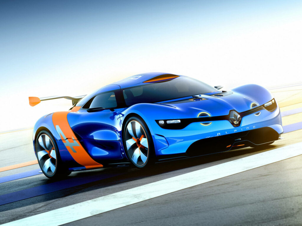 Blue and orange Alpine sports car on sunlit racetrack with sleek aerodynamic design wallpaper