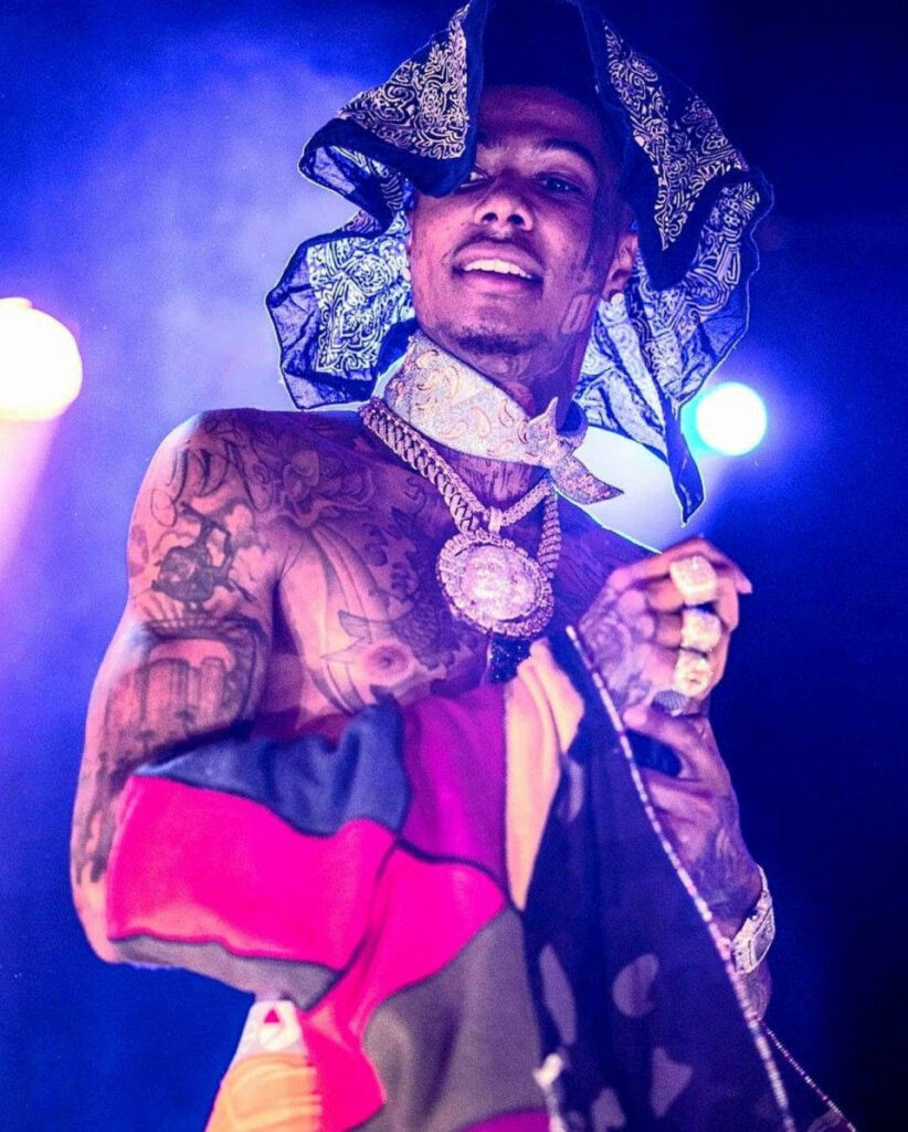 Blueface shirtless with tattoos jewelry colorful clothes patterned headscarf dramatic lighting wallpaper
