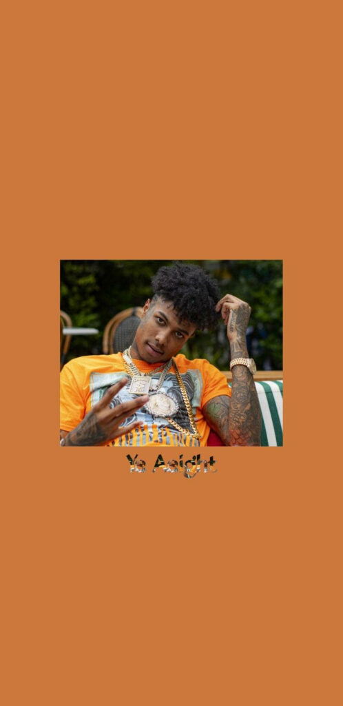 Rapper Blueface posing confidently on orange background with Yea Aight text wallpaper design