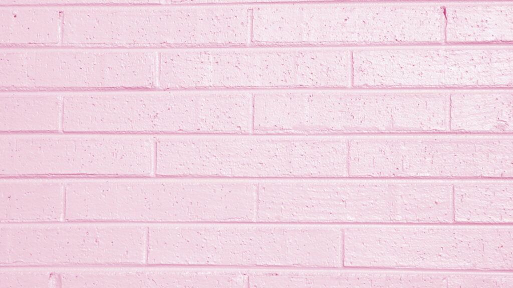 Minimalist blush pink brick wall QHD wallpaper with realistic texture and soft lighting background