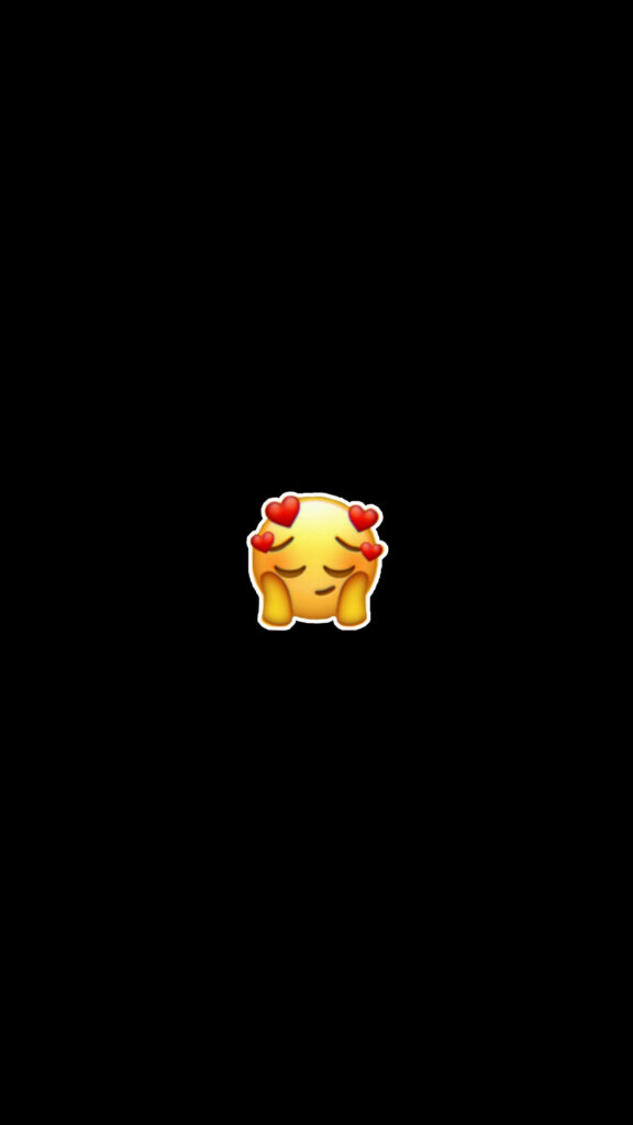 Black backdrop adds intensity to blushing emoji's lovestruck expression Wallpaper