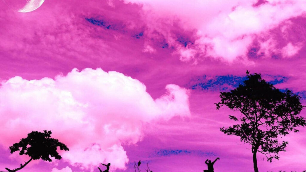 Magical Twilight: Majestic Pink Clouds Over Silhouette of Trees Wallpaper