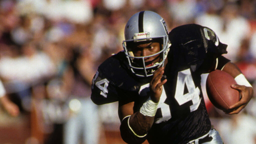 Bo Jackson sprinting with football in hand dynamic wallpaper showing speed and game intensity