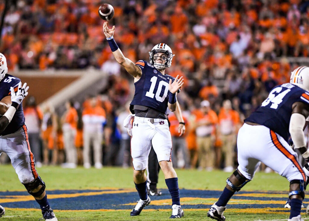 Bo Nix throwing football in action focus quarterback energy game wallpaper background