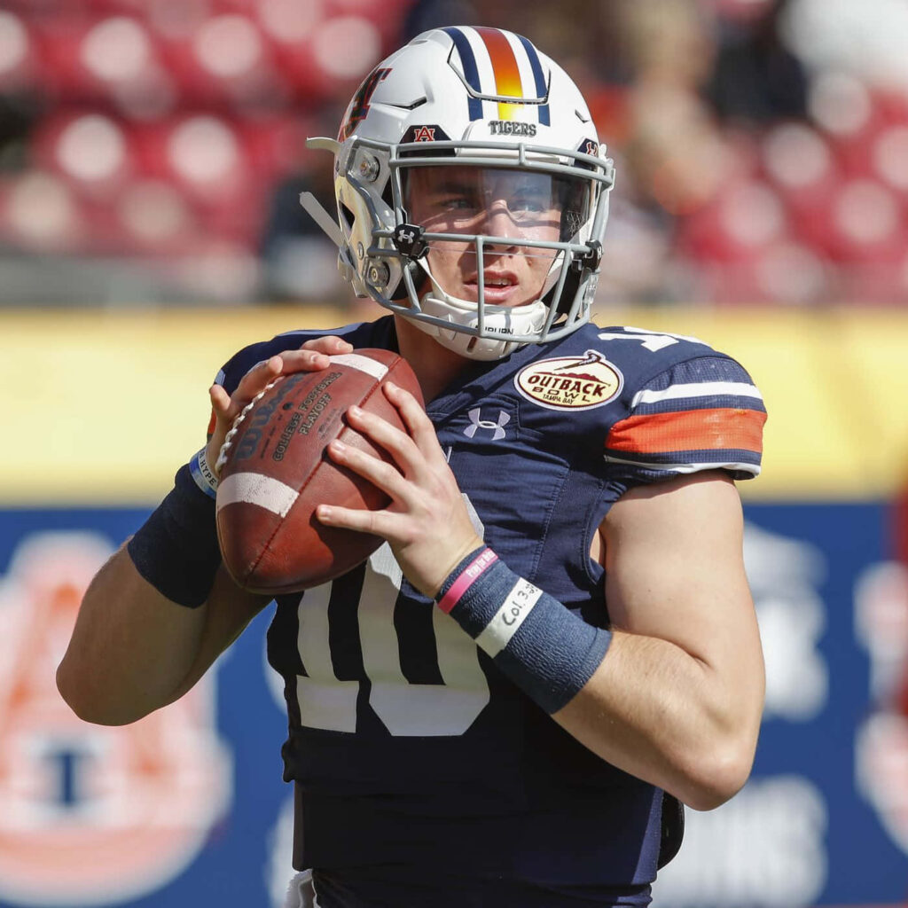 Bo Nix Auburn Tigers quarterback focused preparing to throw pass in college football game wallpaper