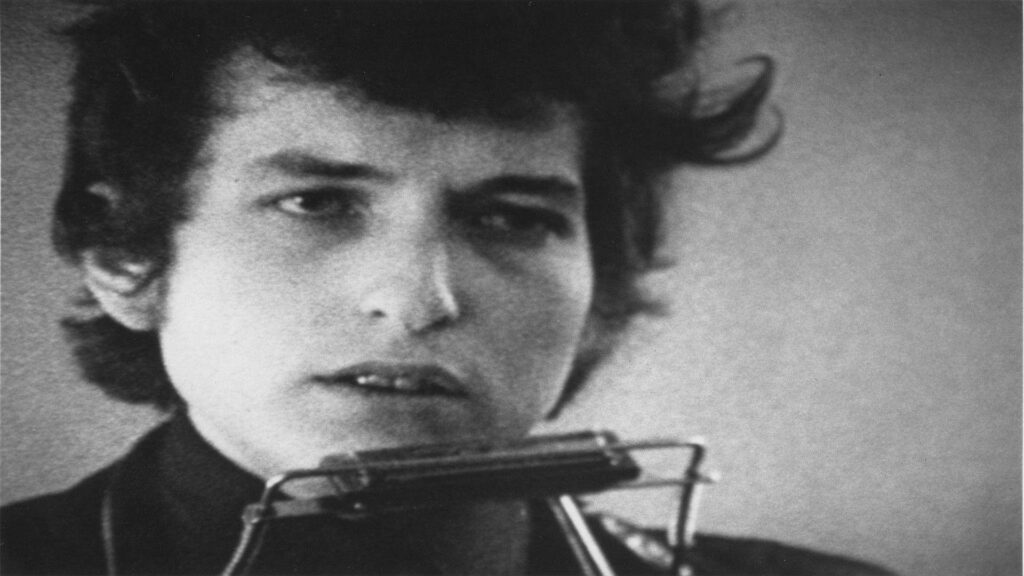 Greyscale portrait of Bob Dylan legendary singer-songwriter capturing iconic artistic intensity Wallpaper