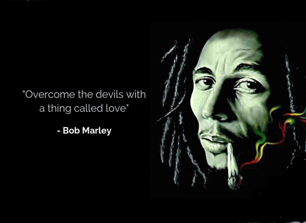 Rebellion in Colors: Bob Marley's Poignant Visual with Rasta Smoke and Inspirational Message Wallpaper