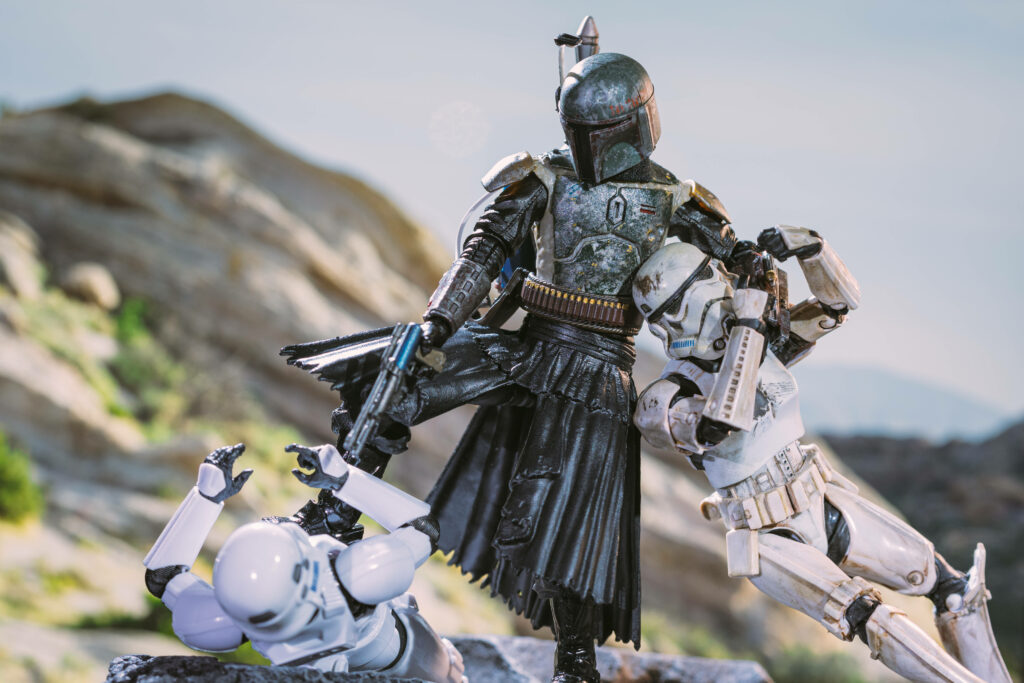 Boba Fett 4K Action Wallpaper: Battling Stormtroopers in Rugged Terrain