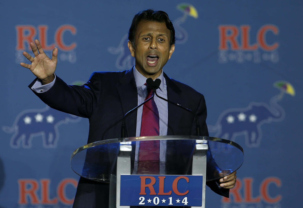 Bobby Jindal speaking passionately at RLC 2014 podium with Republican Party backdrop wallpaper