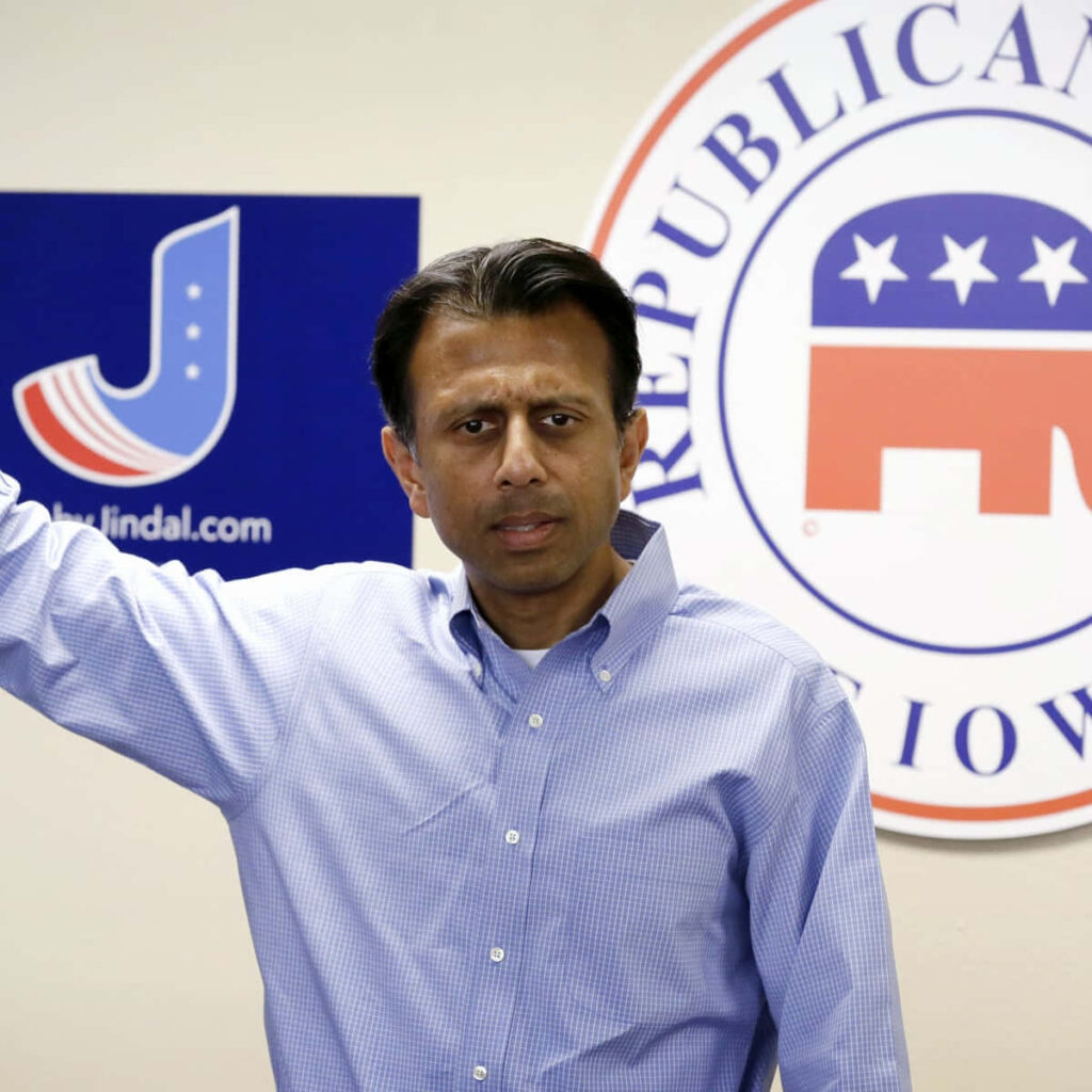 Bobby Jindal at Republican headquarters with campaign signs political involvement wallpaper background