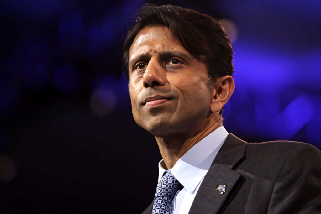 Bobby Jindal portrait wallpaper thoughtful pose professional demeanor soft dramatic background
