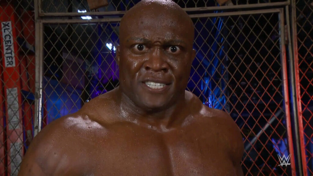 Bobby Lashley fierce pose wrestling steel cage intense energy wallpaper background image
