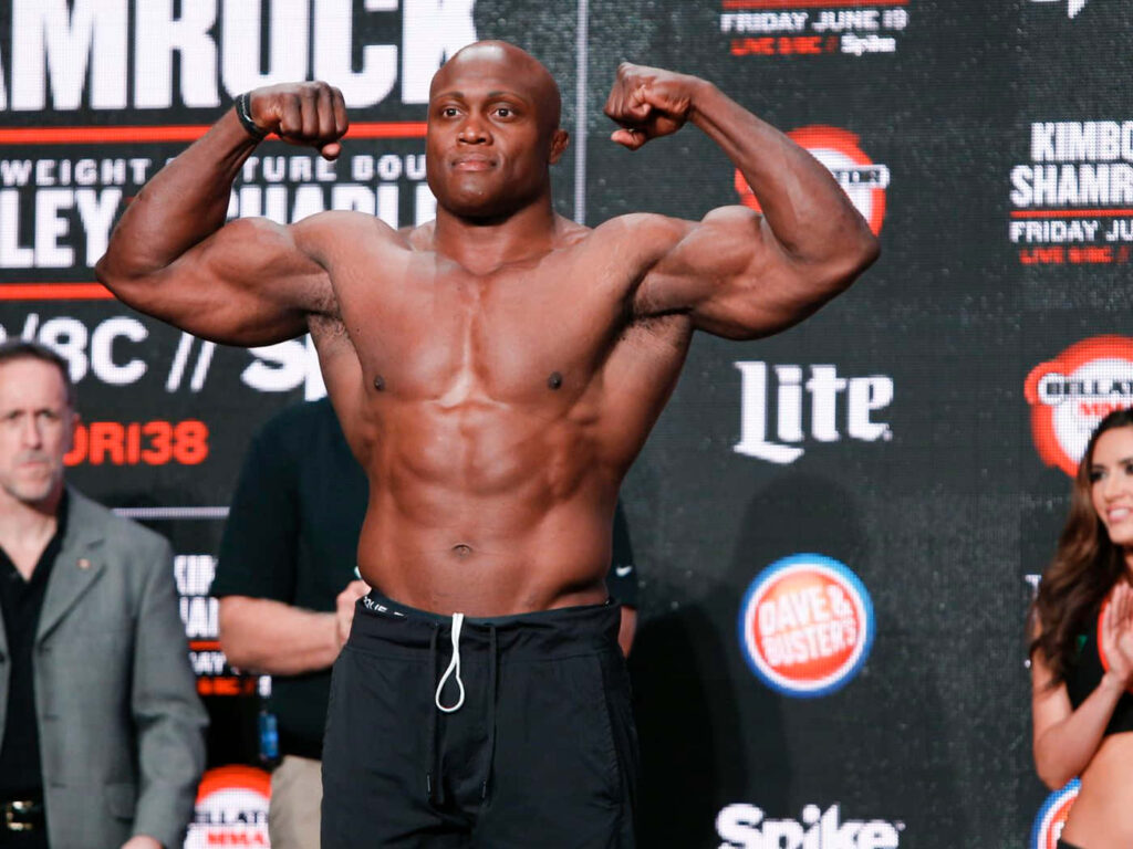 Bobby Lashley flexing muscular biceps showing strength and athletic physique wallpaper background