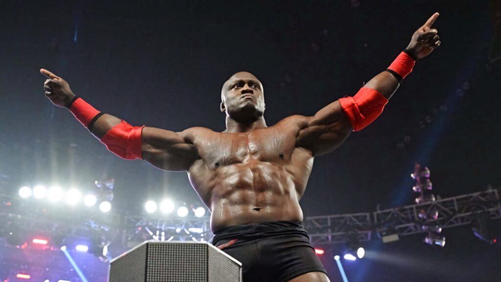Bobby Lashley powerful pose serious expression muscular physique wrestling arena wallpaper background