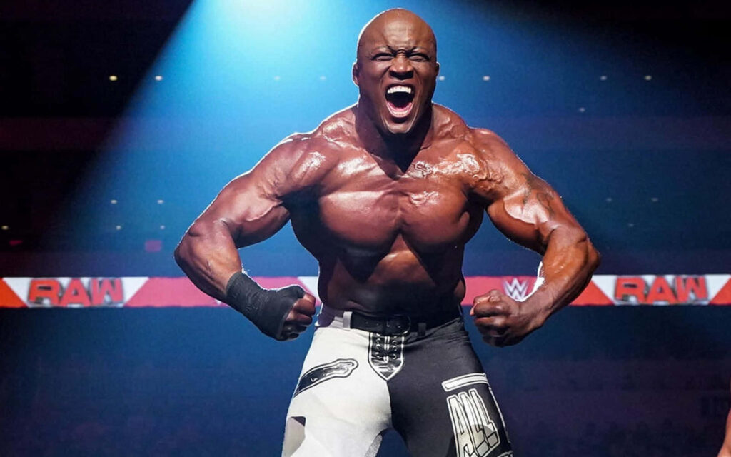 Bobby Lashley flexes muscles in wrestling ring with RAW logo intense energy wallpaper background